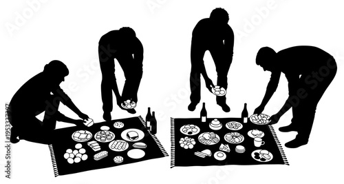 Silhouettes of people setting up a picnic spread on mats with food and drinks