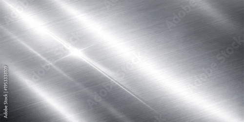 A polished silver stainless steel plate features a brushed metal texture with a shiny metallic surface and a smooth industrial gray pattern perfect for a professional material backdrop wallpaper