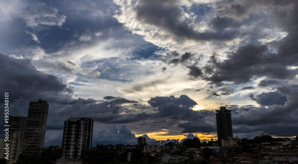 Fototapeta premium Dramatic Storm Clouds Over Brazilian City at Sunset Showing Atmospheric Instability and Weather Formation
