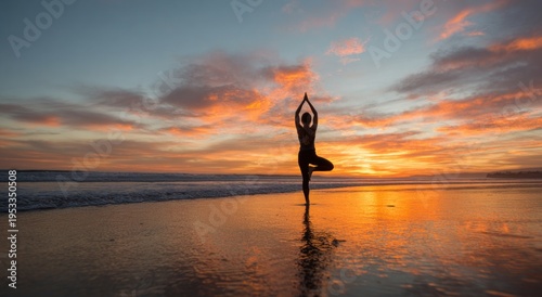 A silhouette of a person practicing yoga on a beach at sunset, with vibrant colors reflecting on the water's surface.