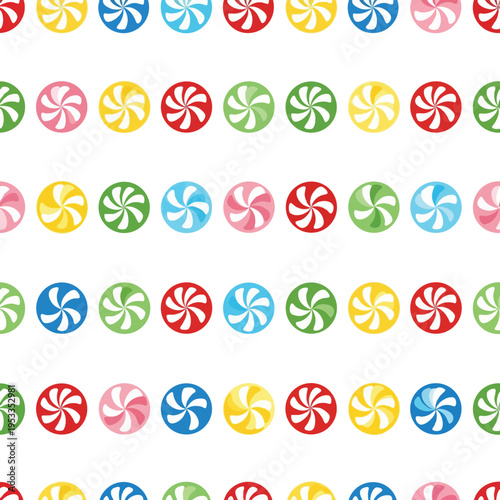 Rows of colorful pinwheel candies arranged in a repeating pattern on white