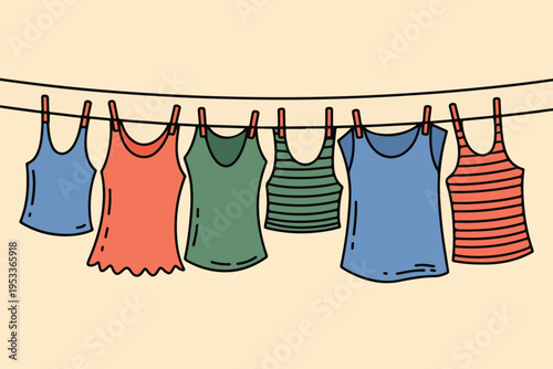Clothes hanging on clothesline with clothespins on a light background, comprising tank tops and shirts in various colors
