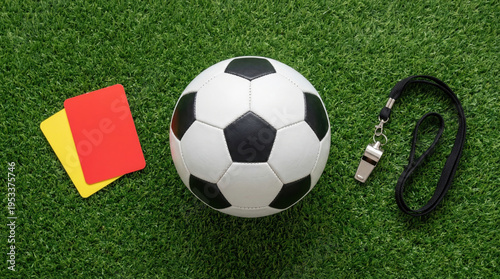 Football world cup preparation gear on grass with soccer ball whistle red card yellow card ready for match