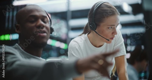 Multicultural Professional Team Reviewing Real Time Financial Indices. Serious Team of Financial Experts Scrutinizes Live Exchange Rates and Indices. High Stakes Decision Making, Analytical Research.