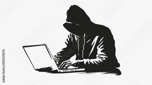 Silhouette of a person using laptop computer in shadowy conditions