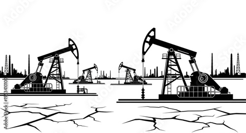 Oil pump jacks extracting crude oil from dry cracked earth.