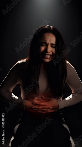 Young Woman Suffering from Severe Abdominal Pain and Stomach Ache