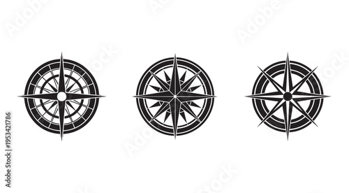 Three black and white compass rose navigation symbols for maps and directions  illustration set