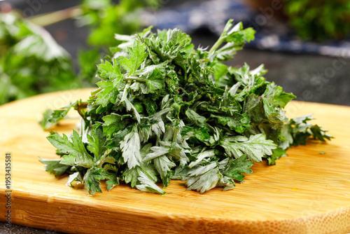 Freshly Harvested Wild Chenopodium Greens on Wooden Cutting Board - Edible Medicinal Plant