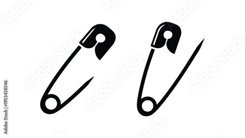 Two black safety pins displayed a striking graphic silhouette