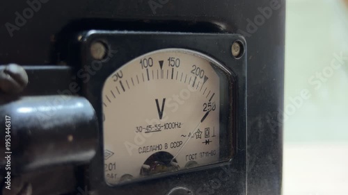 Wallpaper Mural An analog voltmeter needle fluctuates as electricity flows through the internal coils. This electrical regulation produces a steady, low-frequency hum and a faint mechanical vibration. Torontodigital.ca