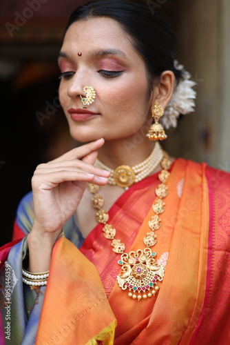 An Indian young woman in a traditional Marathi attire on a Hindu festival. 