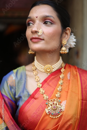 An Indian young woman in a traditional Marathi attire on a Hindu festival. 