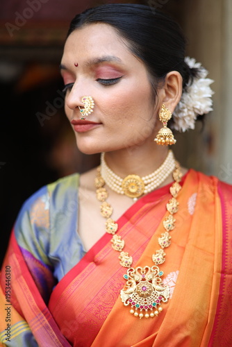 An Indian young woman in a traditional Marathi attire on a Hindu festival. 
