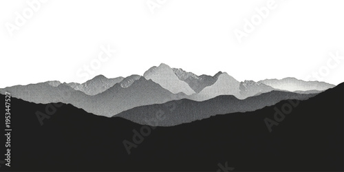 A misty sunrise illuminates the snowy mountain range as fog settles over the blue forest peaks under a cloudy morning sky