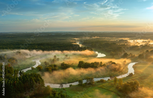 Beautiful spring morning over the forest and river - drone aerial view