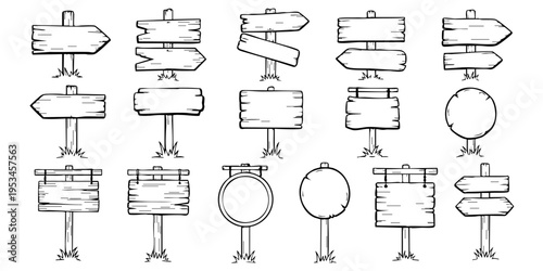 A collection of various wooden signs and pointers on stands.