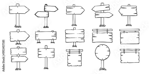 A collection of various wooden signs and pointers are arranged on a surface.