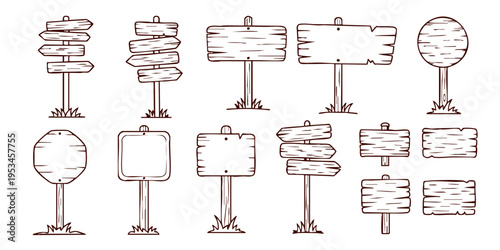 A collection of various blank and directional signs on posts in a landscape setting.