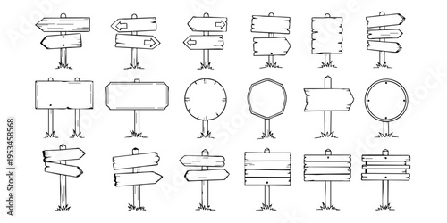 A collection of various blank signs and billboards on stands are displayed outdoors.