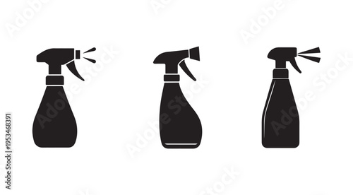 Set of three black spray bottles with different nozzle orientations for cleaning or spraying liquids