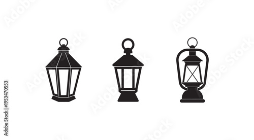 Three black lanterns with different designs and handles on top for hanging  isolated on white background