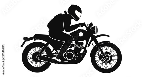 Rider wearing helmet sitting on motorcycle on road in city at night