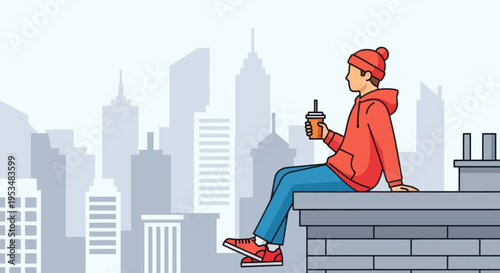 Young adult man sitting on rooftop.