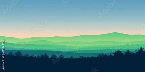 Misty sunrise over a mountain landscape with forest hills and a quiet valley view
