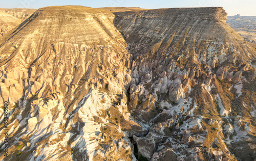 Wallpaper Mural Goreme, Nevsehir, Turkey. Expansive aerial vista of Cappadocia's majestic mountain scenery with sweeping valleys, rocky peaks and vast open spaces under summer light. Aerial view. Torontodigital.ca