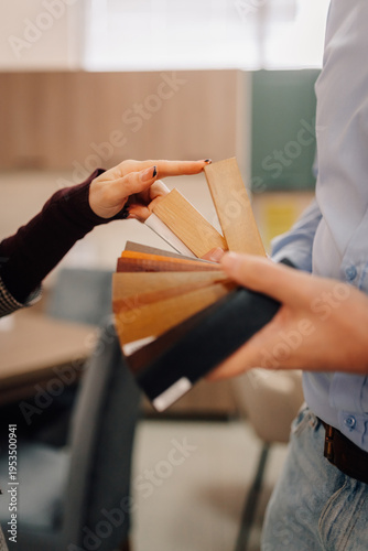 Designers choosing wood material samples for home interior