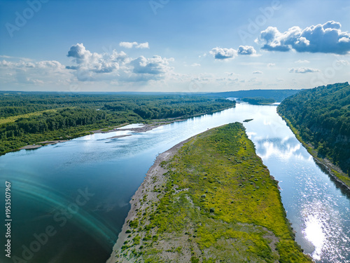 Obraz na plátně Aerial view of Tom River with large vegetated island dividing waterway in Kemero