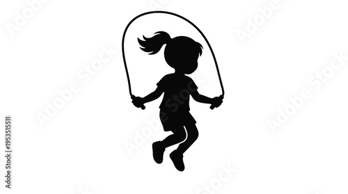 A young girl joyfully jumping rope in a striking silhouette
