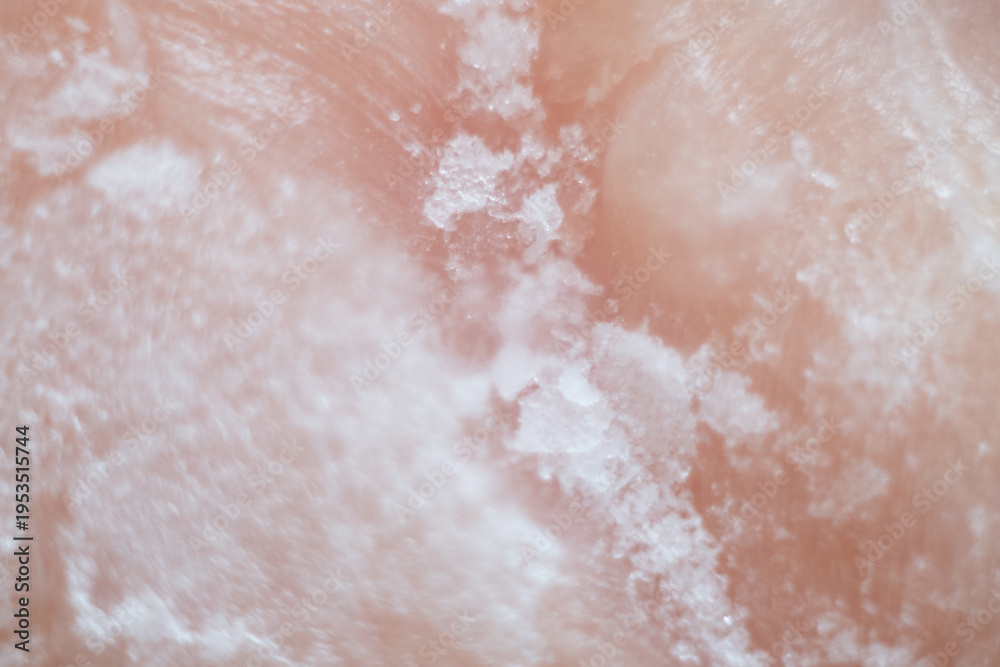Fototapeta premium Macro Ice Crystals on Pink Surface: Soft Abstract Frost Texture
