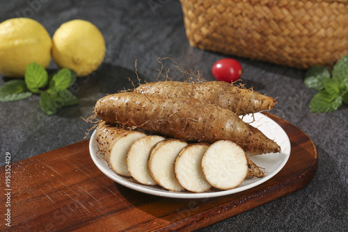 Fresh Chinese Yam Roots Maolichuan Variety from Guangxi Farm - Sweet Dug Root Vegetables with Sliced Pieces on Wooden Board
