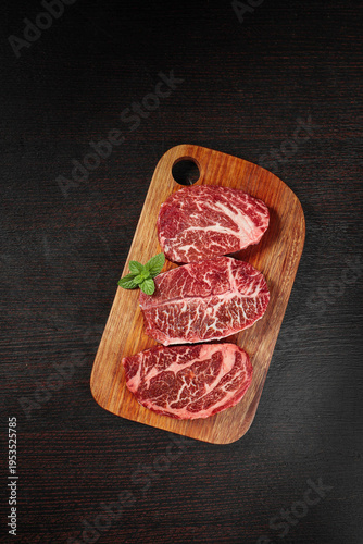 Premium Raw Beef Steaks on Wooden Cutting Board - High-End Food Photography