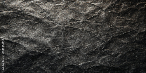 Black fabric texture and wrinkled dark grunge paper material create a rough vintage background with a crumpled surface and old stone wall pattern for a textured design