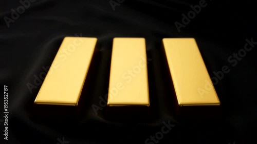 Three shiny gold bars arranged elegantly, symbolizing luxury and wealth in a dark background.