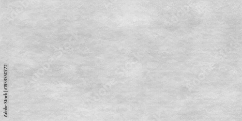 Abstract textured minimalist background in soft shades of grey, evoke a sense of calm and sophistication.