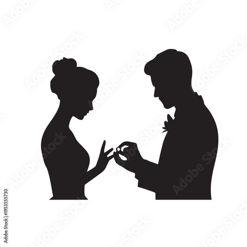 Silhouette of bride and groom exchanging wedding rings