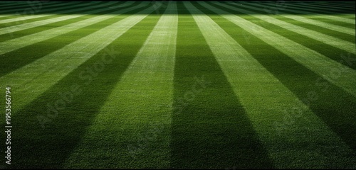 Perfectly Striped Green Grass Field Under Natural Light.