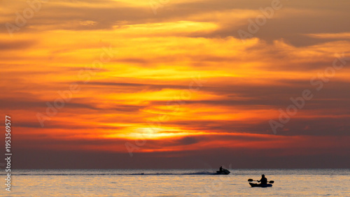 A man is in a kayak on a lake