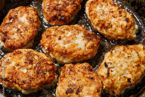 Cuadro en lienzo Minced meat cutlets are fried in oil in a frying pan