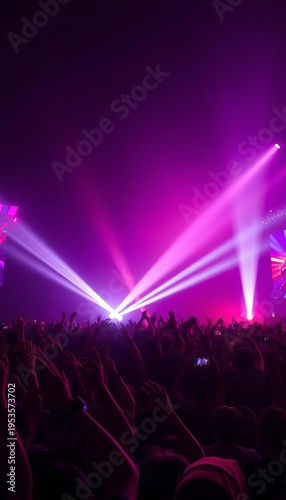 White strobe lights flash illuminating cheering masses at a vibrant music festival,  intense,  celebration