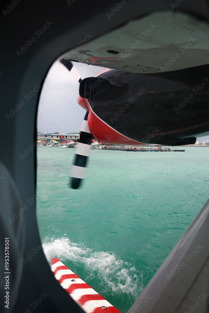 Fototapeta premium Seaplane Window View Over Maldives Turquoise Lagoon and Resort