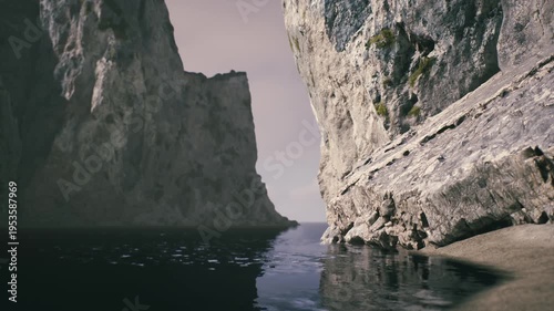 A tranquil view of a coastal area featuring towering cliffs on either side of a calm body of water. The soft light of dusk casts a peaceful ambiance over this natural setting.