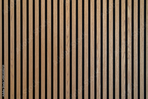 Sound dampening acoustical panels detail of a wooden wall. Wooden wall texture with wood acoustic panels