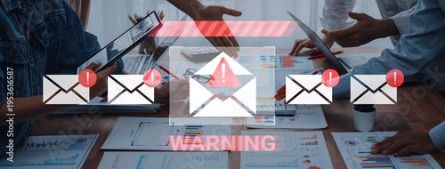 Tableau sur toile Business professionals engage in a meeting surrounded by laptops and reports, with warning alerts overlaying the scene, emphasizing urgency and communication