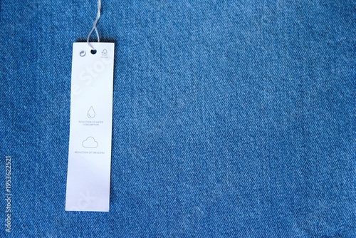 Care Label on blue jeans texture background
