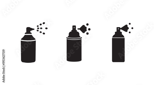Three black spray paint cans with different nozzle designs spraying paint on white background